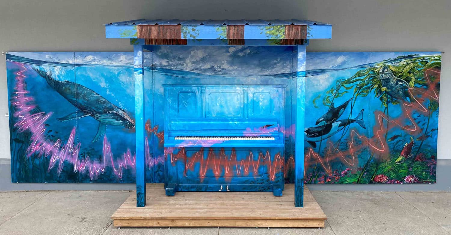 Colorful underwater piano mural installation