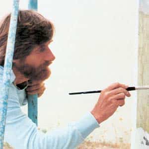 Person painting on a wall