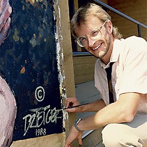 Artist painting mural in 1988