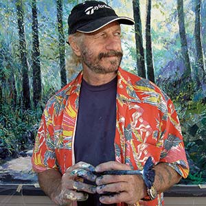 Artist with paintbrush in hand