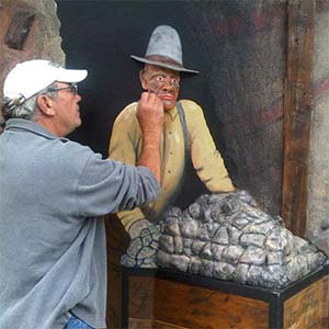 Man interacting with 3D artwork.