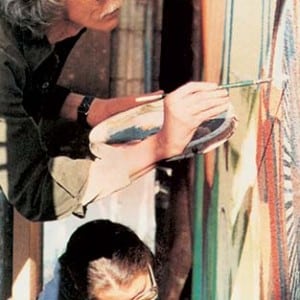 Artists collaborating on a mural.